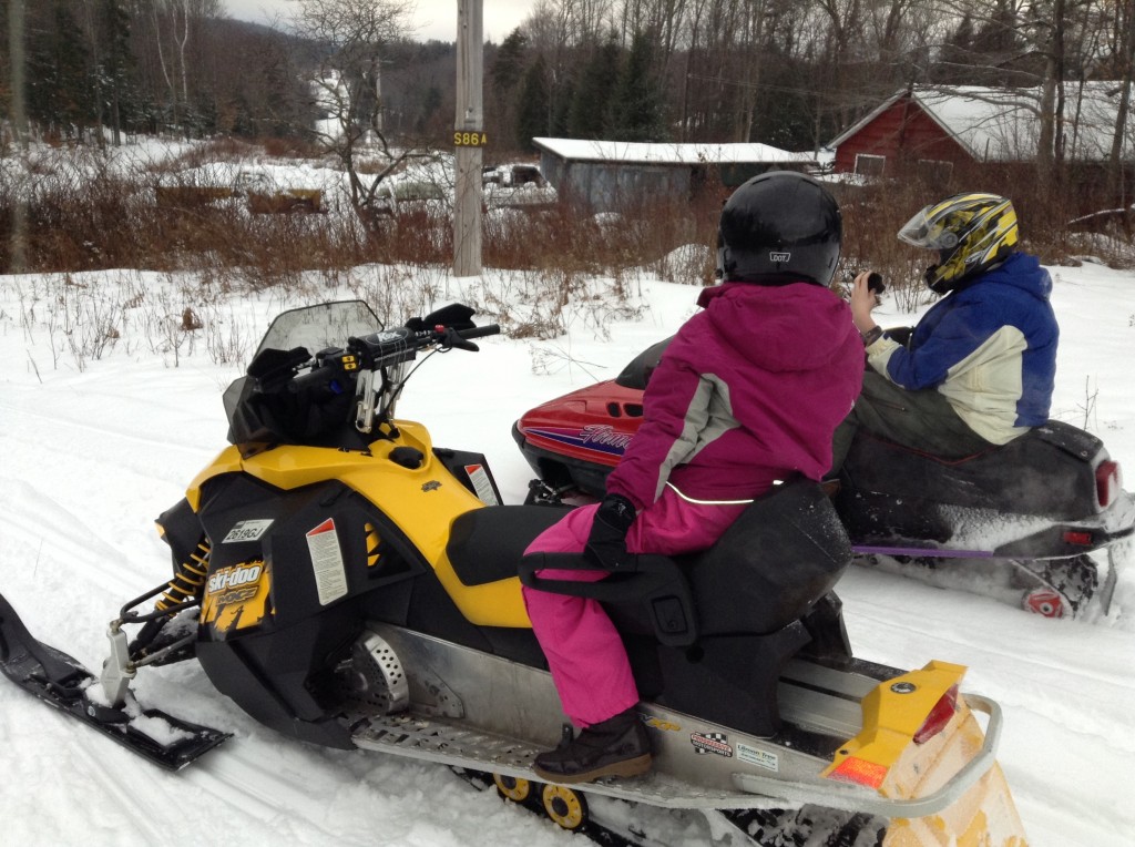 Kids snowmobiling